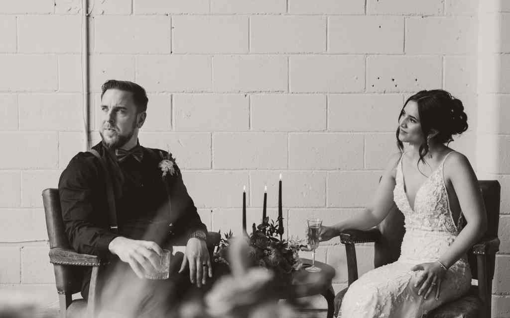 A bride and groom pose for an editorial style black and white photo for a styled shoot in Kelowna, BC