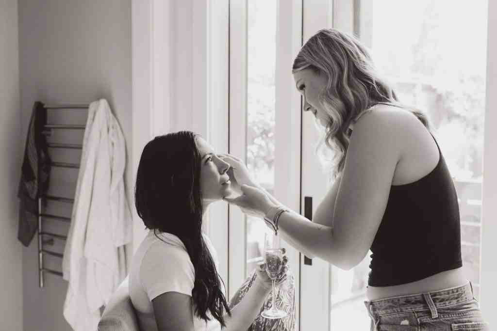 A bride gets her makeup applied just before her backyard wedding ceremony in Kelowna, BC