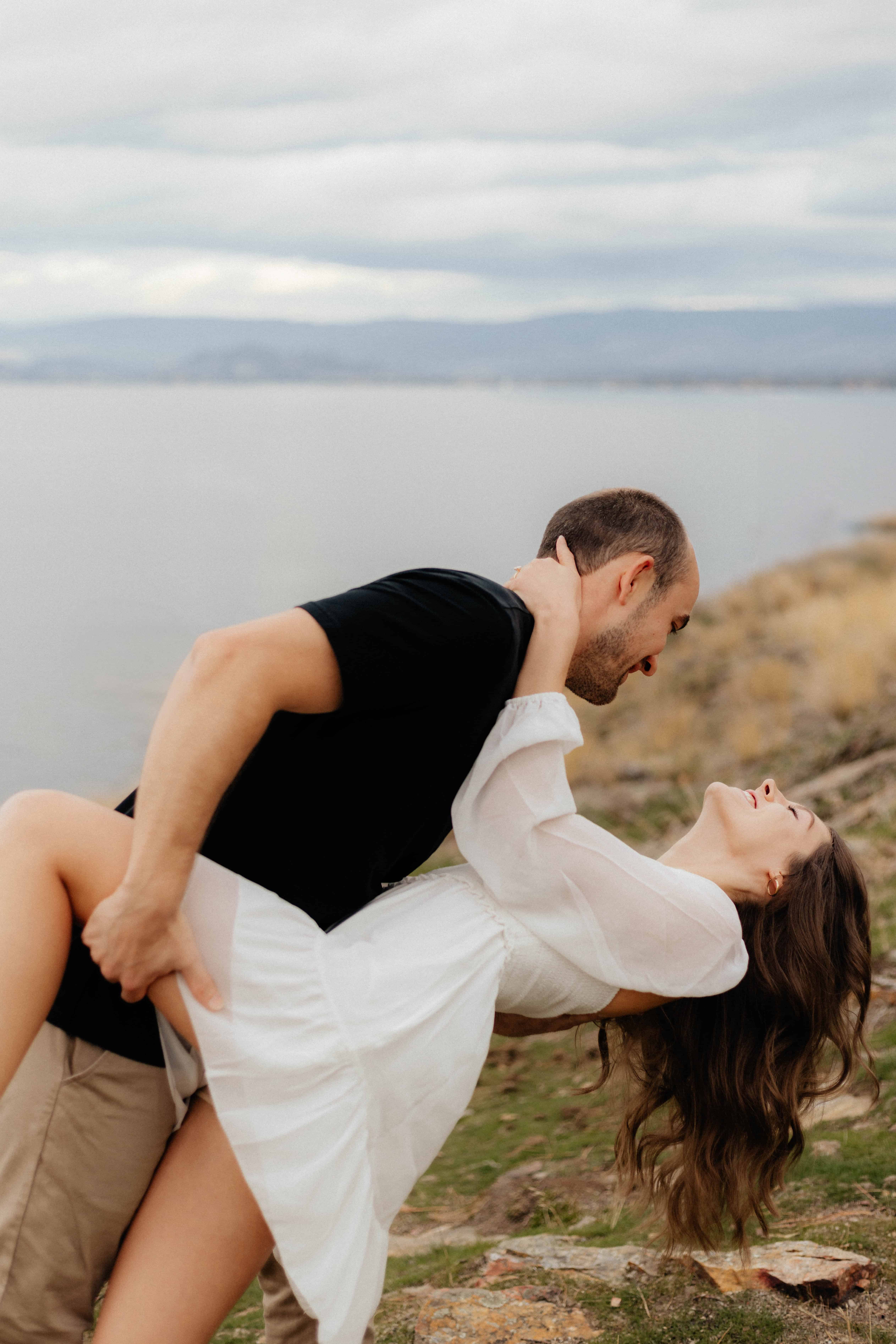 A couple happily dances as they celebrate their engagement at Bertram Creek Park in Kelowna
